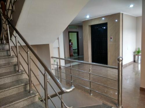 a staircase with metal railings in a building at Hotel Raj Palace in Dibrugarh