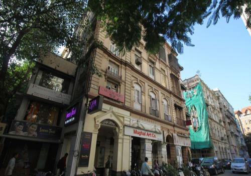 a building on the side of a city street at Carlton Hotel Mumbai - Behind Taj Mahal Palace Colaba Mumbai in Mumbai