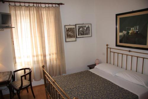 Tempat tidur dalam kamar di Hotel Morlacchi