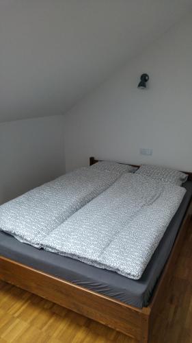 a bed sitting in a room with a mattress at Miedzywody in Ostrowite