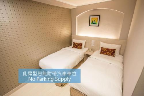 Кровать или кровати в номере Golden Stone Hotel