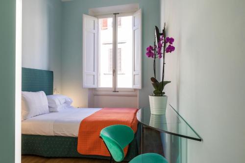 Кровать или кровати в номере Hotel la Scala