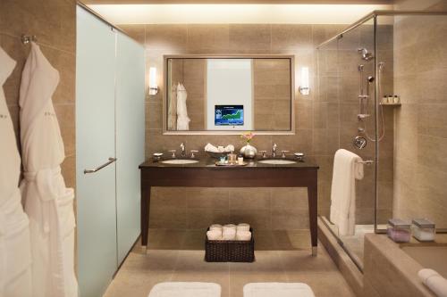 a bathroom with two sinks and a shower at Trump International Hotel & Tower Chicago in Chicago