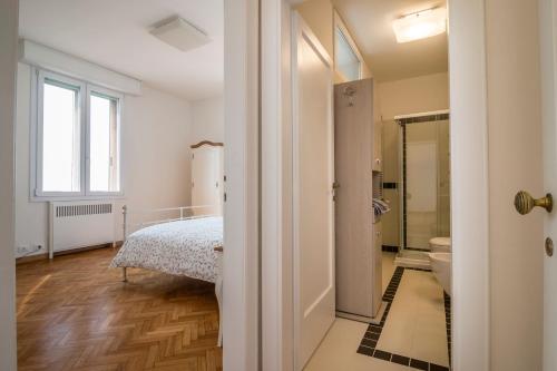 a bedroom with a bed and a bathroom at PADOVA TOWER 13TH FLOOR in Padova