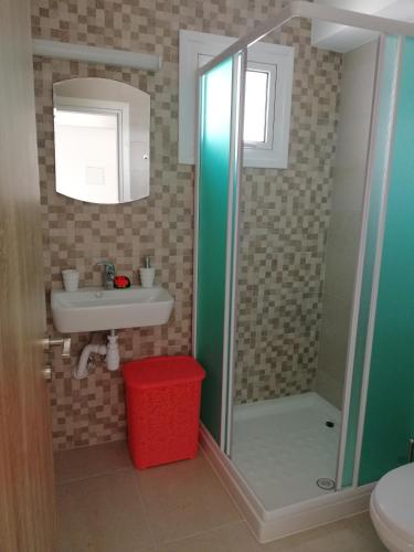 a bathroom with a shower and a sink at Chicos Studios in Ayia Napa