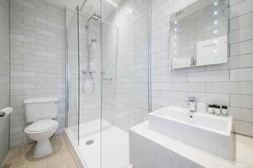 a bathroom with a toilet and a shower and a sink at Miller & Carter Maidstone by Innkeeper's Collection in Maidstone