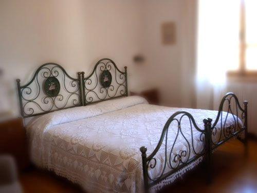 Postel nebo postele na pokoji v ubytování Albergo Ristorante Letizia