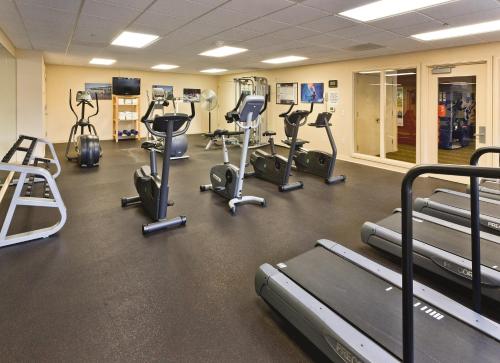 a gym with several treadmills and exercise bikes at WorldMark Seaside in Seaside
