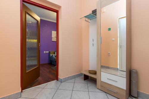 a hallway with a door leading into a room at apartments TONI with free parking in Ka&scaron;tela