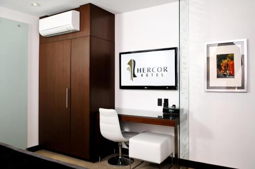 a office with a desk and a white chair at Hercor Hotel - Urban Boutique in Chula Vista