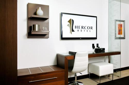 a office with a desk and a white chair at Hercor Hotel - Urban Boutique in Chula Vista