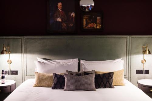 a bedroom with a bed with white sheets and pillows at Avon Gorge by Hotel du Vin in Bristol