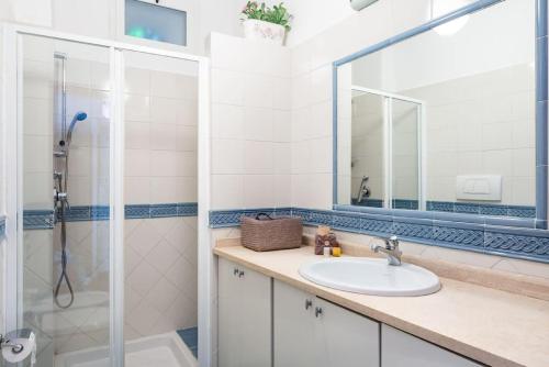 a bathroom with a sink and a shower at Trevispagna Charme Apartment Autonomous in Rome