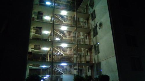 a tall building with balconies on the side at night at Departamento Bosques del Tabo in El Tabo
