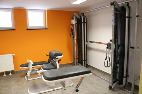 a gym with two chairs in a room at Willa Mare Nostrum Gdynia - pokoje gościnne in Gdynia