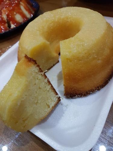 a piece of cake on a plate on a table at Pousada Recanto das Águas in Lumiar