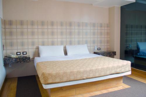 Ліжко або ліжка в номері Hotel Santa Cruz