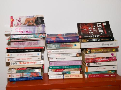 a pile of books sitting on top of a table at Amaryllis in Plataniás