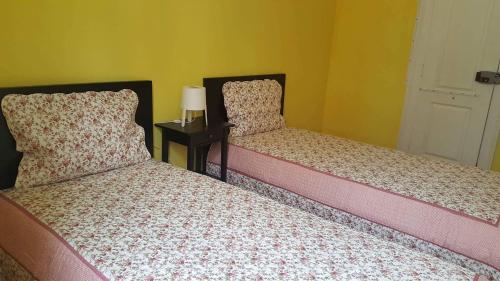 Katil atau katil-katil dalam bilik di Cenário Catita Hostel