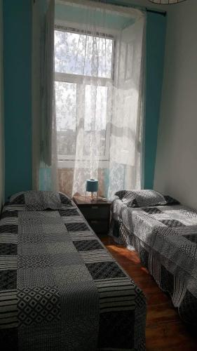 Katil atau katil-katil dalam bilik di Cenário Catita Hostel