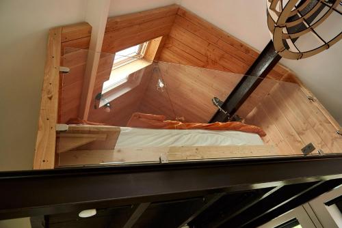 an overhead view of a bed in an attic at Bed in Beek in Beek