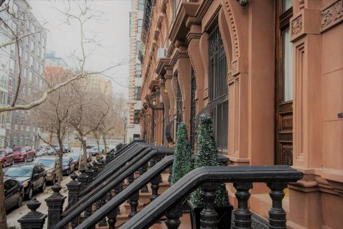 a balcony with christmas trees on the side of a building at Harlem Grand in New York