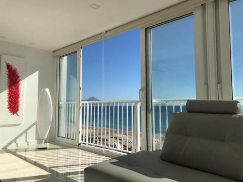 a living room with a view of the ocean at Texas in Alicante