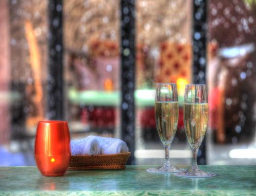 three glasses of champagne sitting on a table at Balinese onsen ryokan Hakone Airu in Hakone