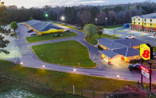 an aerial view of a parking lot at a gas station at Super 8 by Wyndham Chipley in Chipley