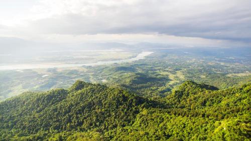 an aerial view of a lush green mountain range at Melia Ba Vi Mountain Retreat in Hanoi