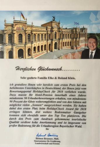 a letter with a picture of a building at Drei Tannen in Bodenmais