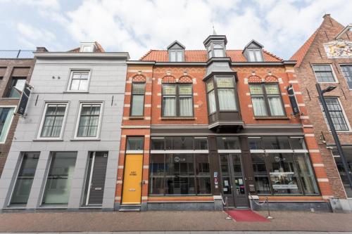 a group of buildings on a city street at Hotel Zilt in Vlissingen