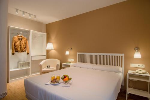 Ένα ή περισσότερα κρεβάτια σε δωμάτιο στο Hotel Los Cigarrales