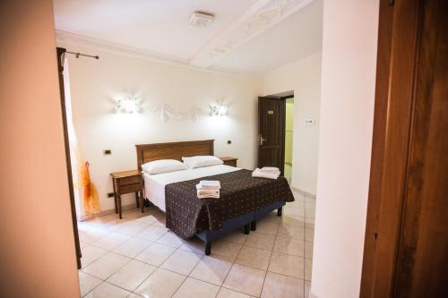 Postel nebo postele na pokoji v ubytování Hotel Grifo