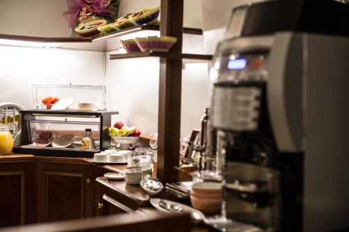 Kuchyň nebo kuchyňský kout v ubytování Hotel Grifo