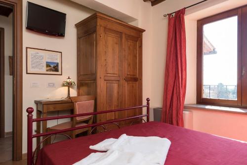 Katil atau katil-katil dalam bilik di Bed & Breakfast Suvereto