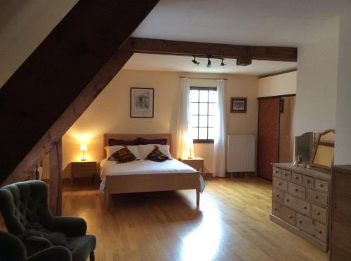 Un pat sau paturi într-o cameră la Le Coze