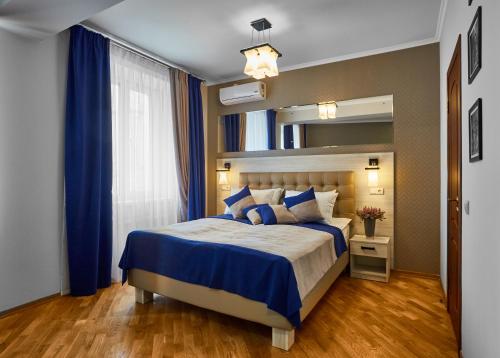 Кровать или кровати в номере ANTARES Apart hotel