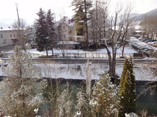a winter view of a city with snow covered trees at Appartementhaus Maria in Radstadt