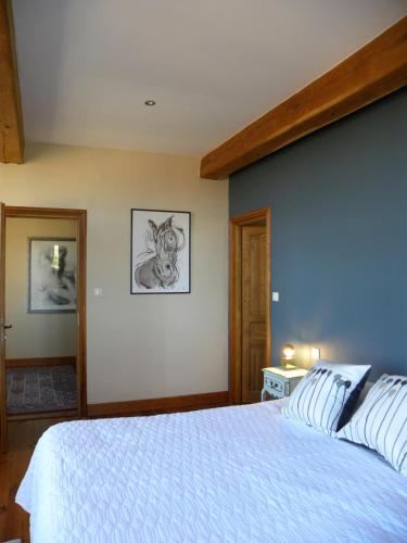 Postel nebo postele na pokoji v ubytování Maison Olleris