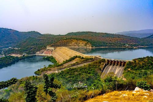 an aerial view of a dam on a river at 3A's Guest House in Oko Sombo