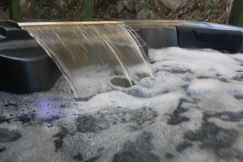 a water fountain in a pool of snow at Chabanettes Hotel & Spa in Auzelles