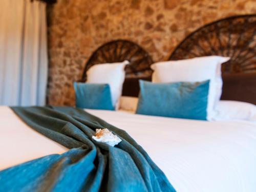 Katil atau katil-katil dalam bilik di Hotel Molí de l'Escala