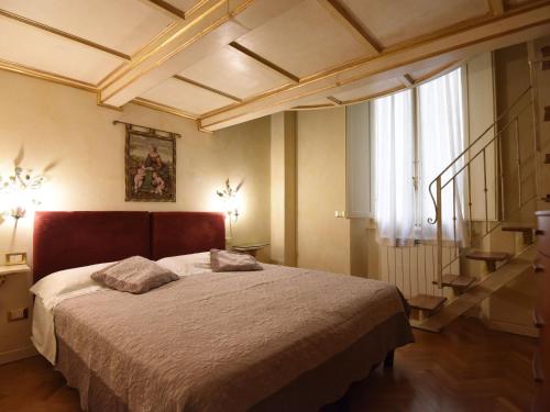 Lova arba lovos apgyvendinimo įstaigoje Belvilla by OYO Dei Medici