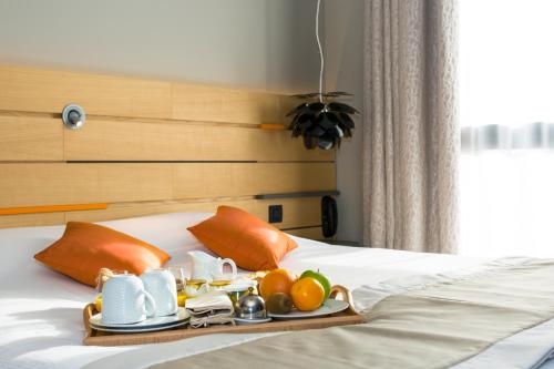 En eller flere senge i et værelse på Logis Hôtel du Morvan - Restaurant la Table de Jérôme