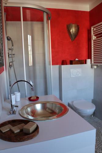 a bathroom with a sink and a toilet at Hostellerie de Genève in Vevey