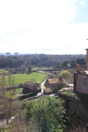 a view of a farm with a field and buildings at Platea Oche in Sutri