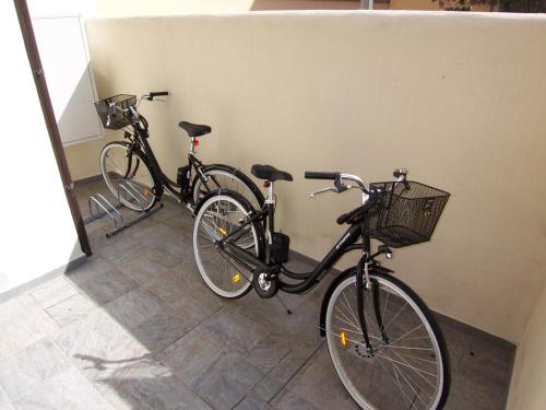 two bikes are parked next to a wall at Florence Dalmazia Fast Check In on line in Florence