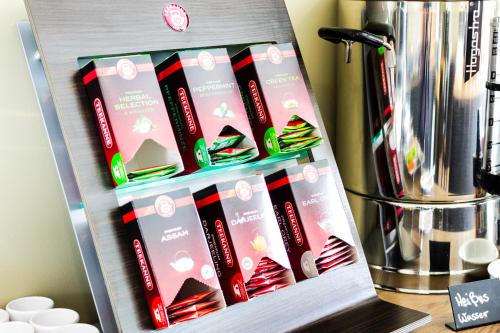 a shelf with a bunch of boxes on it at MountainPark | Event- und Tagungshotel in Kassel