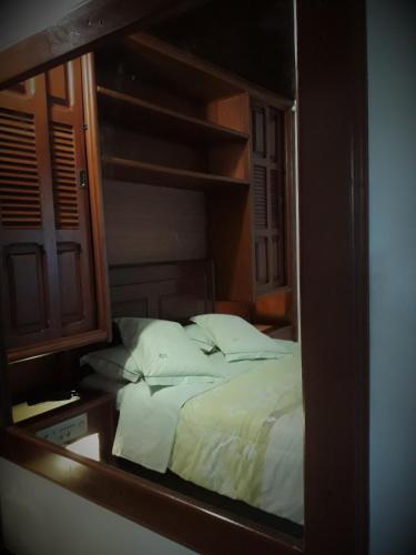 Ένα ή περισσότερα κρεβάτια σε δωμάτιο στο Gallardin Palace Hotel